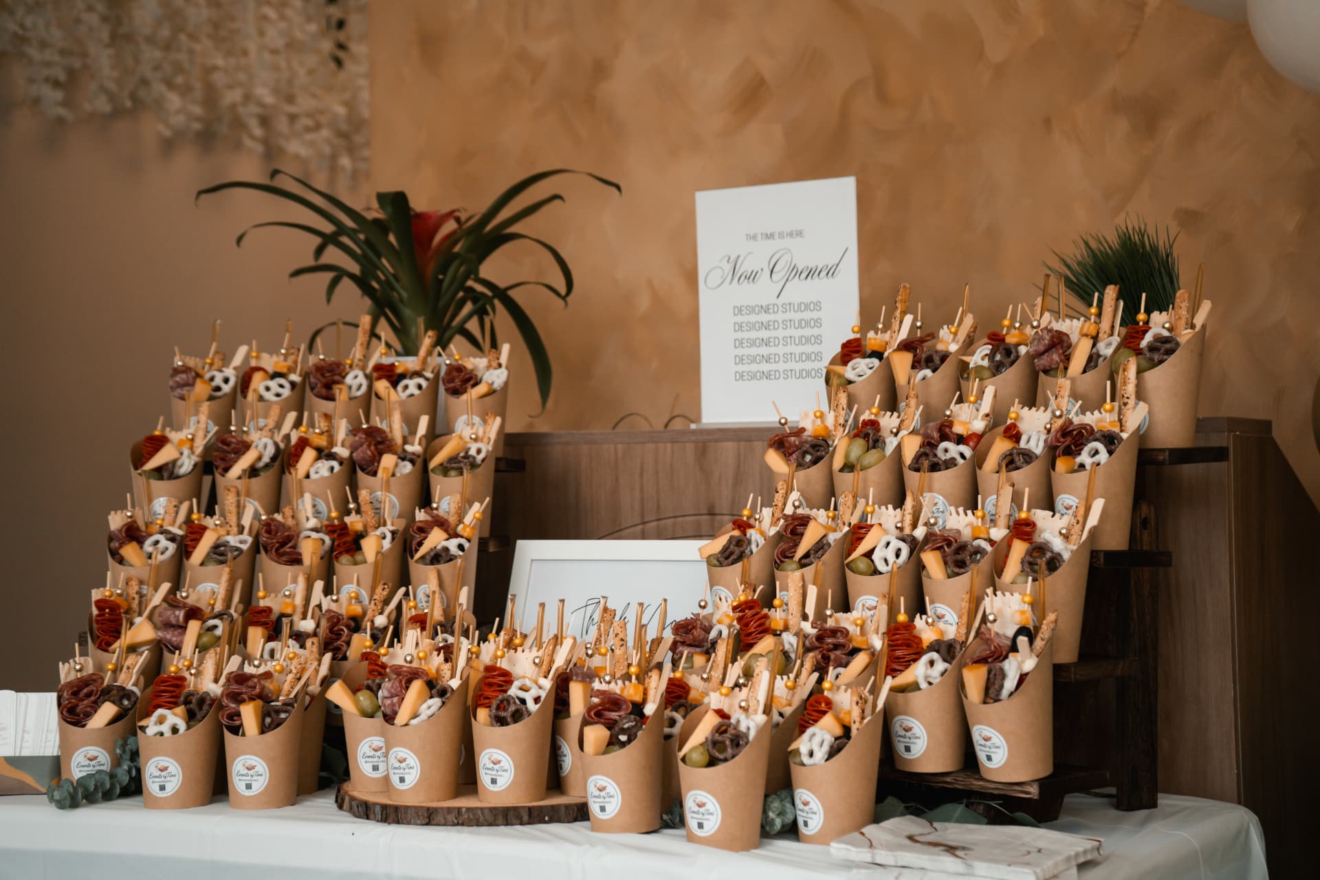 Events by Tini charcuterie cups arranged on a styled display